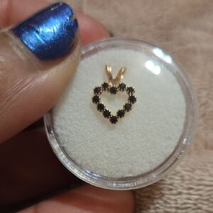14k solid gold and blue sapphire charm .3grams